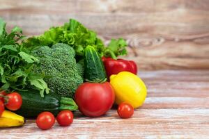 Vegetables and fruits on a wooden table. Thanksgiving Day. Healthy food, harvesting. Copy space. photo