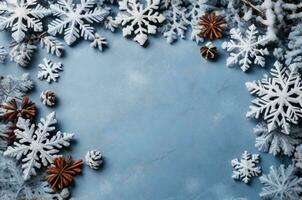 AI generated Christmas background with snowflakes and cones on light blue slate texture. Top view, copy space. Winter flatlay. photo