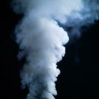 steam Smoke over black background. Fog or steam texture. Hot photo