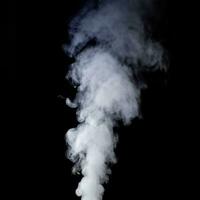 steam Smoke over black background. Fog or steam texture. Hot photo