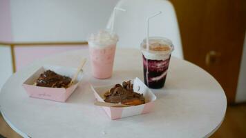 Blueberry Drink and Cinamon Roll Chocolate cake or Dessert on the table photo