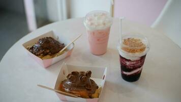 Blueberry Drink and Cinamon Roll Chocolate cake or Dessert on the table photo