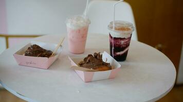 Blueberry Drink and Cinamon Roll Chocolate cake or Dessert on the table photo