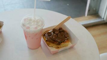 Blueberry Drink and Cinamon Roll Chocolate cake or Dessert on the table photo