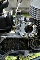 Repair of an old motorcycle. Analysis of the generator. Internal parts of the motor. photo