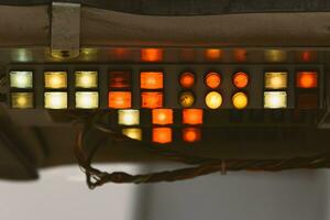 Old school panel with red, yellow and green buttons photo