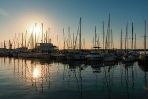 Pula, Croatia - Aug 20, 2019 - Spectacular sunset in Pula, small private yachts in the shadows photo