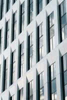 Sky reflecting on white office facade photo