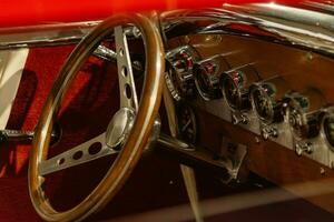 Red hot rod interior with metal gauges photo