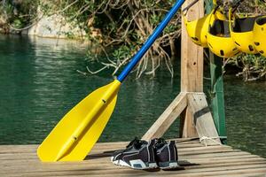 Pier for rafting with folded equipment - helmets, oar. Goynuk canyon, Antalya photo