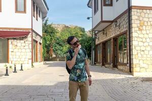 tourist eat ice cream on the street of an mediterranean town photo