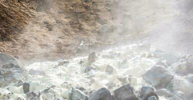 sulfur deposits among the vapors in the bed of a hot geothermal spring photo