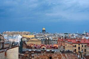 top view of the city roofs in the historical center of Saint Petersburg with rainy sky photo