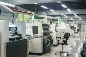 production line for printed circuit board manufacturing mounted in workshop photo