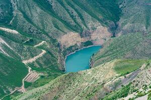 mountain landscape, deep canyon with a blue river at the bottom photo