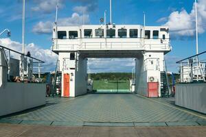 entrance to the road ferry at the river crossing photo