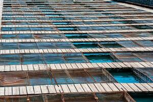 aquaculture installations with fish cages on a fish farm photo