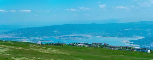 view of the small mountain town of Dubki on the banks of the Chirkey reservoir in Dagestan photo