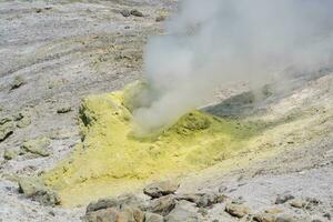 active solfatara, source of sulfurous gases on the slope of the volcano photo