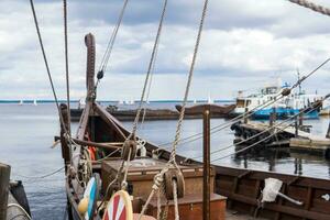 fragment of the rigging of a wooden old sailing ship close-up photo