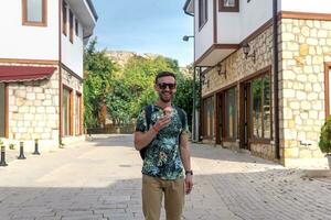 cheerful tourist with ice cream in an mediterranean town photo