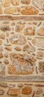 background, texture - rough masonry from wild stone and cement on a wooden frame photo