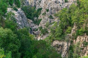 landscape with a small mountain river in a deep rocky gorge in the Taurus mountains, Turkey photo