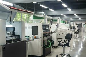 workshop with production line for printed circuit board, automatic chip mounter photo