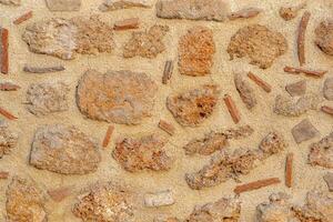 background, texture - rough masonry from wild stone and cement photo