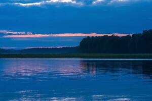 natural landscape, white night over the wide northern lake photo