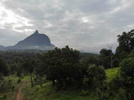 a view of the mountains from a hillside. Serelo Hill is located in Perangai Village, Lahat regency, and it becomes one of popular landmark in Lahat regency. photo