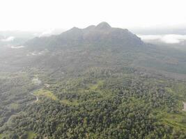 a view of the mountains from a hillside. Serelo Hill is located in Perangai Village, Lahat regency, and it becomes one of popular landmark in Lahat regency. photo