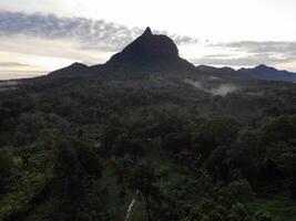 a view of the mountains from a hillside. Serelo Hill is located in Perangai Village, Lahat regency, and it becomes one of popular landmark in Lahat regency. photo