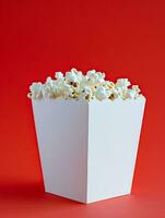 AI generated blank pop corn box mockup in plain red isolated background photo