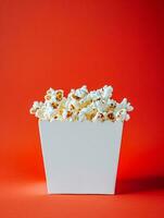 AI generated blank pop corn box mockup in plain red isolated background photo