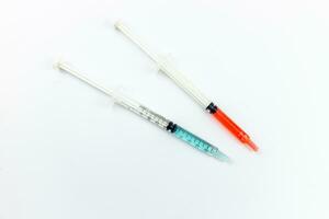 Medical syringes on a white background. Close-up. photo