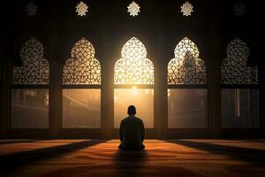 ai generado un persona comprometido en oración dentro un mezquita durante el sagrado mes de Ramadán foto