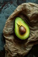 AI generated a slice of avocado on a brown cloth photo