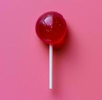 AI generated a lollipop on a pink background photo