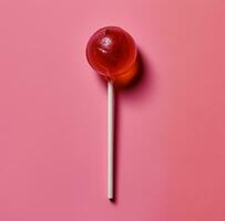 AI generated a lollipop on a pink background photo