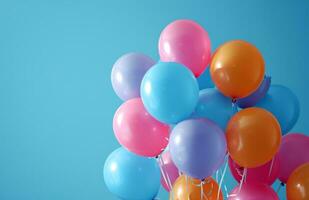 ai generado grupo de vistoso globos en un azul antecedentes fiesta foto