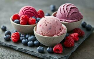 AI generated ice cream with raspberry and blueberries in bowls on a flat stone surface photo