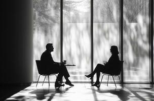 AI generated two business people sitting together having a discussion photo