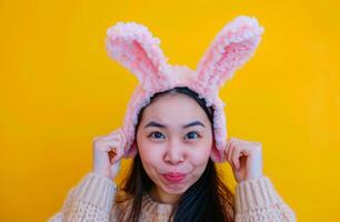 AI generated a woman holding bunny ears as she makes a face photo