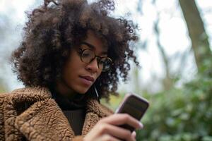 AI generated young afro american woman holding a phone outdoors photo