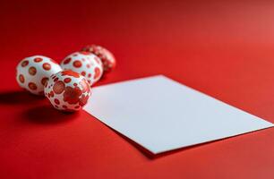 AI generated a white sheet of paper with red and white easter eggs and white card on a red background photo