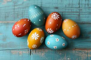 AI generated colorful painted eggs on blue wooden background photo