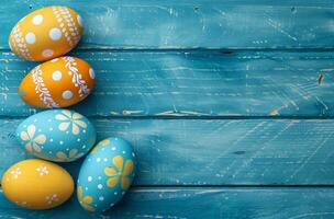 AI generated colorful painted eggs on blue wooden background photo