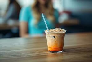 AI generated coffee latte is on a table in a cafe with a child holding a straw photo