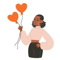 A young woman holds red balls in the shape of hearts for Valentine's Day vector